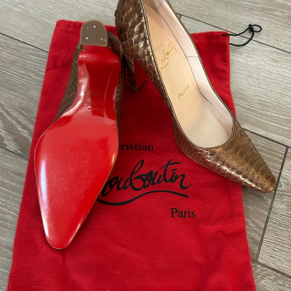 Christian Louboutin gold snakeskin pumps